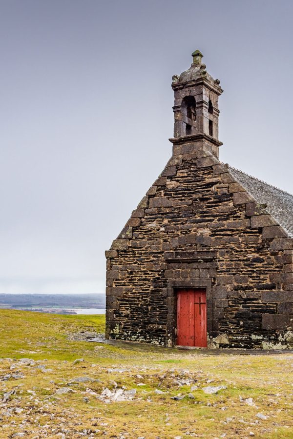 the-chapel-saintmichel-de-braspart-is-located-on-top-of-a-hill-that-dominates-lake-brennilis